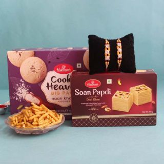 box of cookies, half kg soan papdi, 200 grams mixture with 2 rakhis 