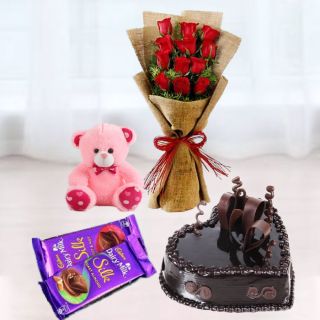 Bunch of 10 red roses, heart shape chocolate cake , 6 inch pink teddybear, set of 2 dairy milk silk 