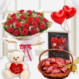 Bunch of 12 red roses with 1 feet height teddybear, basket of kitkat chocolates, valentine day card with pair of 2 heart shape balloons 