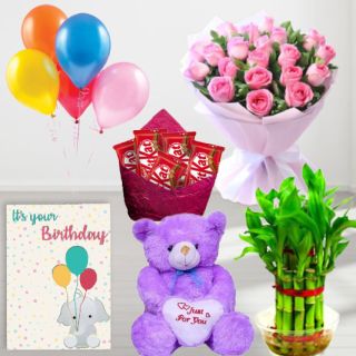 Bunch of 15 pink roses, 6 inch height teddybear, pack of 5 Kitkat chocolates, 2 layer Lucky bamboo plant ,5 blown balloons with birthday greeting card
