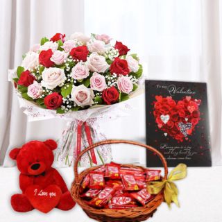Bunch of 15 red and pink roses, 6 inch red teddy bear, basket of kit kat chocolates, valentine card 