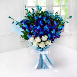 Bunch of 8 blue orchids with 5 white roses 