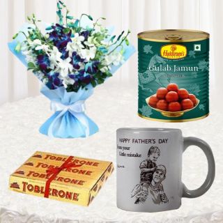 Bunch of blue and white orchids, box of 1 kg gulabjamun, set of 3 toblerone chocolates with photo mug