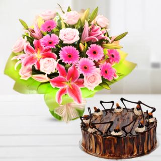 Bunch of lilies roses gerberas with irish chocolate cake 