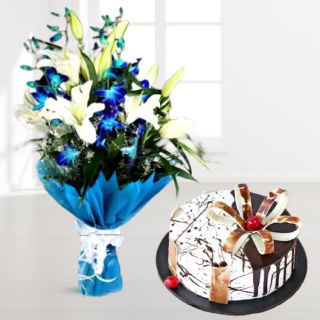 Bunch of white lilies with blue orchids with choco vanilla cool cake 
