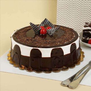 1 kg choco delight cake with knife and candles