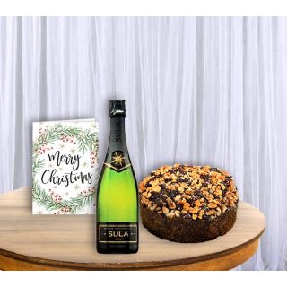 Dryfruit plum cake , bottle of wine, greeting card