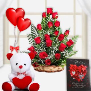 Elegant Love -- Basket Arrangement of 15 red roses with 6 inch teddybear with 2 heart shape blown balloons 