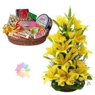Exclusive 2 feet height arrangement of yellow lilies with a premium chocolate hamper of rich delicious chocolates