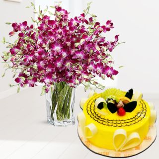 Exclusive vase arrangement of 25 purple orchids with pineapple premium cake 