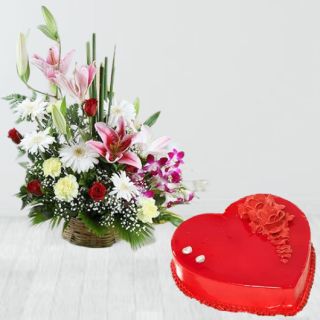Exotic Basket arrangement of mix flowers with lilies, roses, orchids, gerberas, carnations with strawberry heart shape cake 