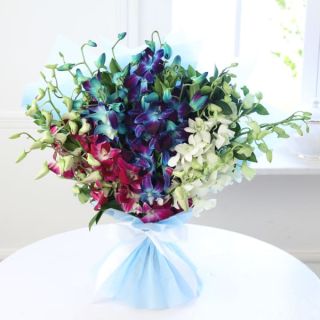 Exotic hand bouquet of blue ,purple and white orchids 