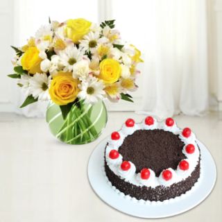 exotic vase arrangement of mix flowers with black forest cool cake 