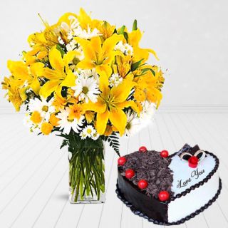 Exotic vase arrangement of yellow lilies, daisies, roses with heart shape black forest cool cake 