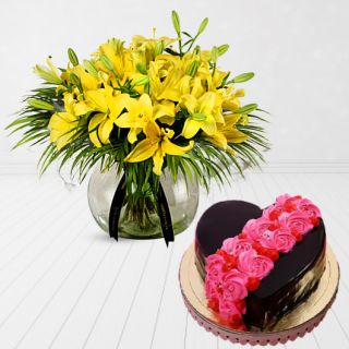 exotic vase arrangement of yellow lilies with heart shape chocolate cake with floral theme 