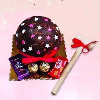 Half kg chocolate piñata cake with dairy milk, kitkat and rocher ferrero chocolates