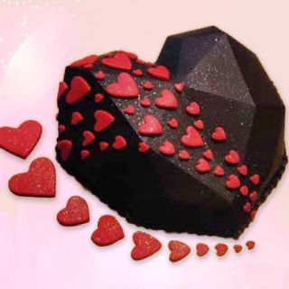 Half kg heart shape pinata theme cake  in chocolate  truffle flavour 
