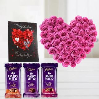 Heart shape arrangement of 25 pink roses , 3 dairy milk silk with valentine Greeting card 