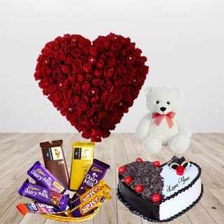 Heart shape arrangement of 40 red roses, basket of assorted chocolates, heart shape black forest cake, with 1 feet height teddy bear 