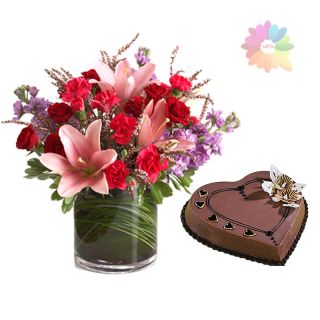 Mix exotic flowers arranged in  glass vase with 1 kg heart shape chocolate cake