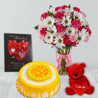 Mix flowers in glass vase, half kg mango cool cake, 6 inch teddybear with valentine greeting card  