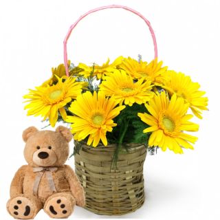 basket of yellow gerberas with teddy