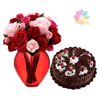 Red and pink roses arranged in glass vase with 1 pound chocolate delight fresh cream cake