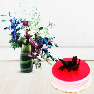 Vase arrangement of mix colour orchids with strawberry cake 