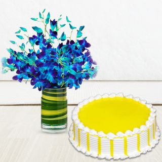 Vase Arrangement of 10 blue orchids with pineapple cool cake 