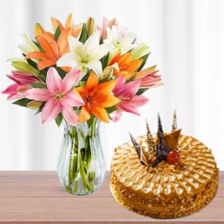 Vase arrangement of 10 mix colour lilies with premium quality butterscotch cake 