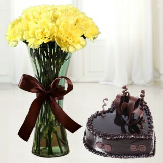 Vase arrangement of 10 yellow carnations with heart shape chocolate cake 