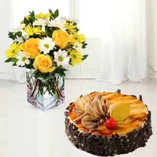 Vase arrangement of 12 gerberas and roses with irish chocolate cake 