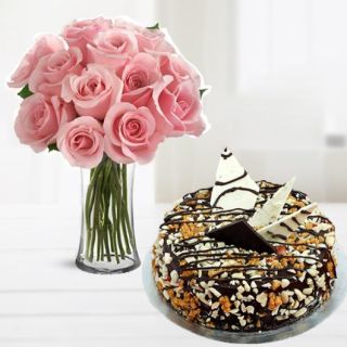 Vase arrangement of 12 pink roses with dry fruit cool cake 