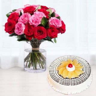 Vase arrangement of 12 red and pink roses with pineapple cool cake 