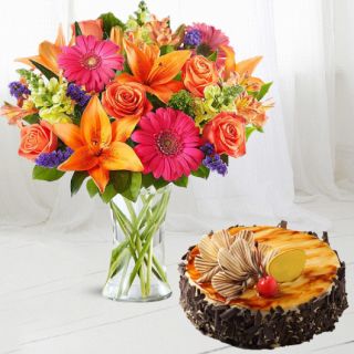 Vase arrangement of 15 mix flowers with half kg irish coffee cake 