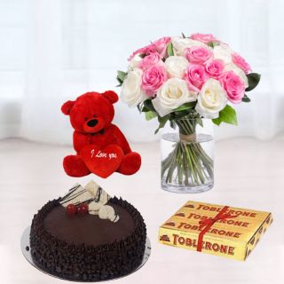 Vase arrangement of 15 pink and white roses, choco chips cake, set of 2 toblerone chocolates, 6 inch red teddy bear chocolates 