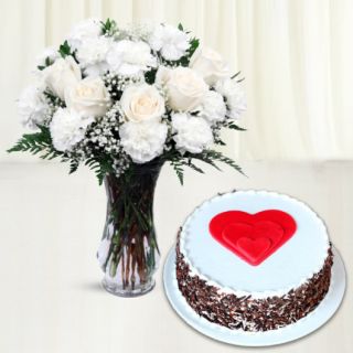 vase arrangement of 15 white carnations with black forest cool cake 
