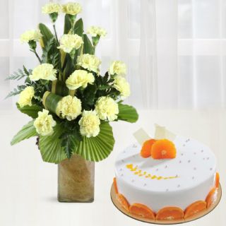 Vase arrangement of 15 yellow carnations with orange cake 