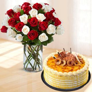 Vase arrangement of 20 red and white roses with half kg honey cool cake 