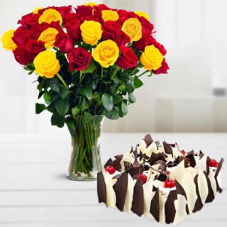 Vase arrangement of 20 red and yellow roses with half kg white forest cool cake 
