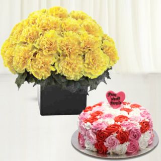 Vase arrangement of 20 yellow carnations with vanilla floral theme cake 