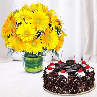 Vase arrangement of 20 yellow gerberas with black forest cool cake 