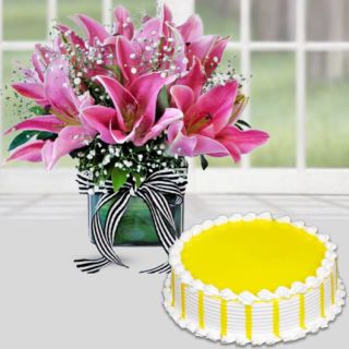 Vase arrangement of 5 pink lilies with pineapple cool cake 