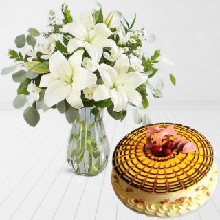 Vase arrangement of 5 white lilies with butterscotch cool cake 