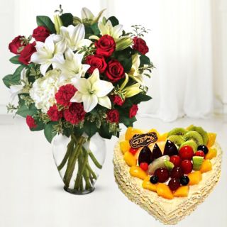 vase arrangement of exotic mix flowers with mix fruit premium quality cake 