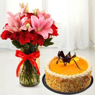 Vase arrangement of lilies and carnations with honey cool cake 