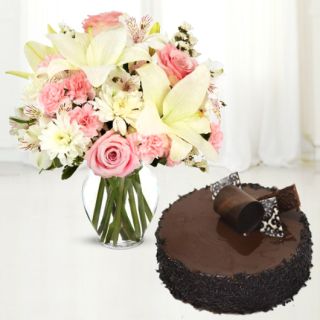Vase arrangement of lilies, roses and carnations with choco chips cake 