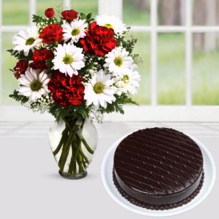 Vase arrangement of mix flowers with chocolate cake 