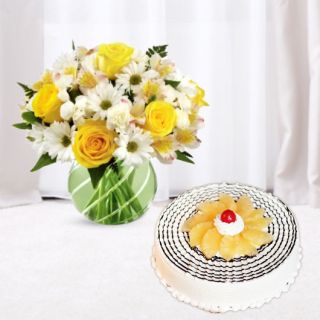Vase arrangement of mix flowers with pineapple cool cake 