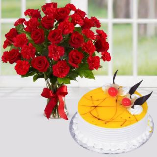 Vase arrangement of red roses with red carnations with premium quality pineapple cake 